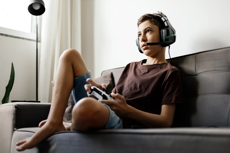 Person playing video games on a computer screen